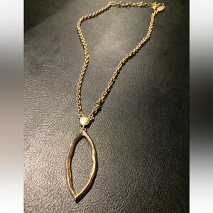 Antique Gold abstract oval pendant long necklace and dangling earrings.